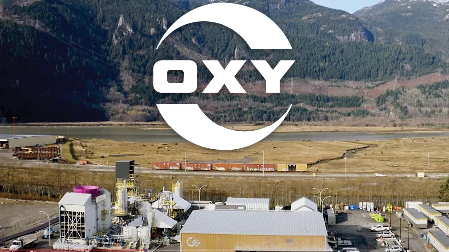 The Occidental Petroleum logo (shortened to OXY) over an image of the company's Carbon Engineering operation