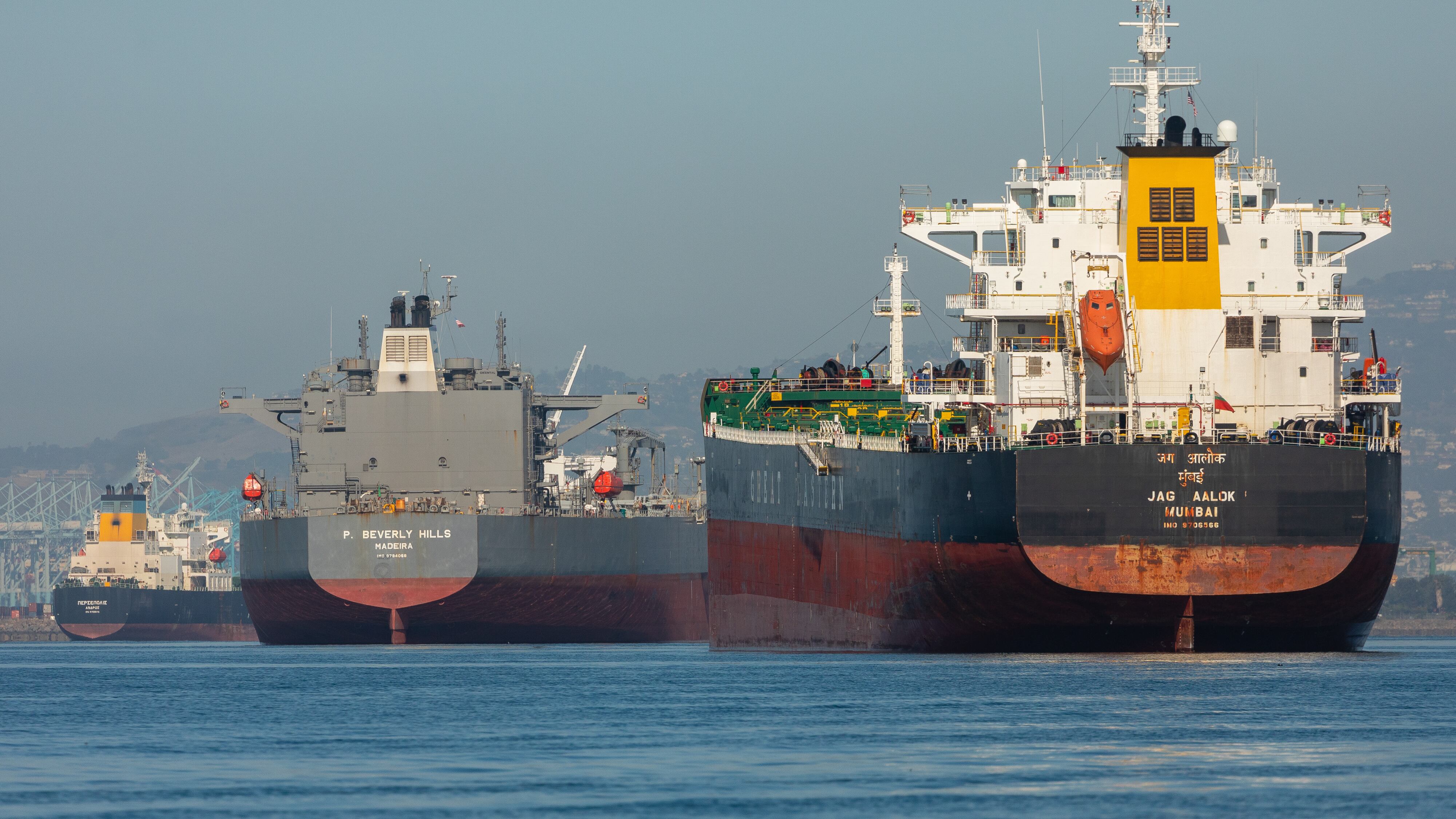 Tankers waiting to unload cargo at the Port of Long Beach in California.