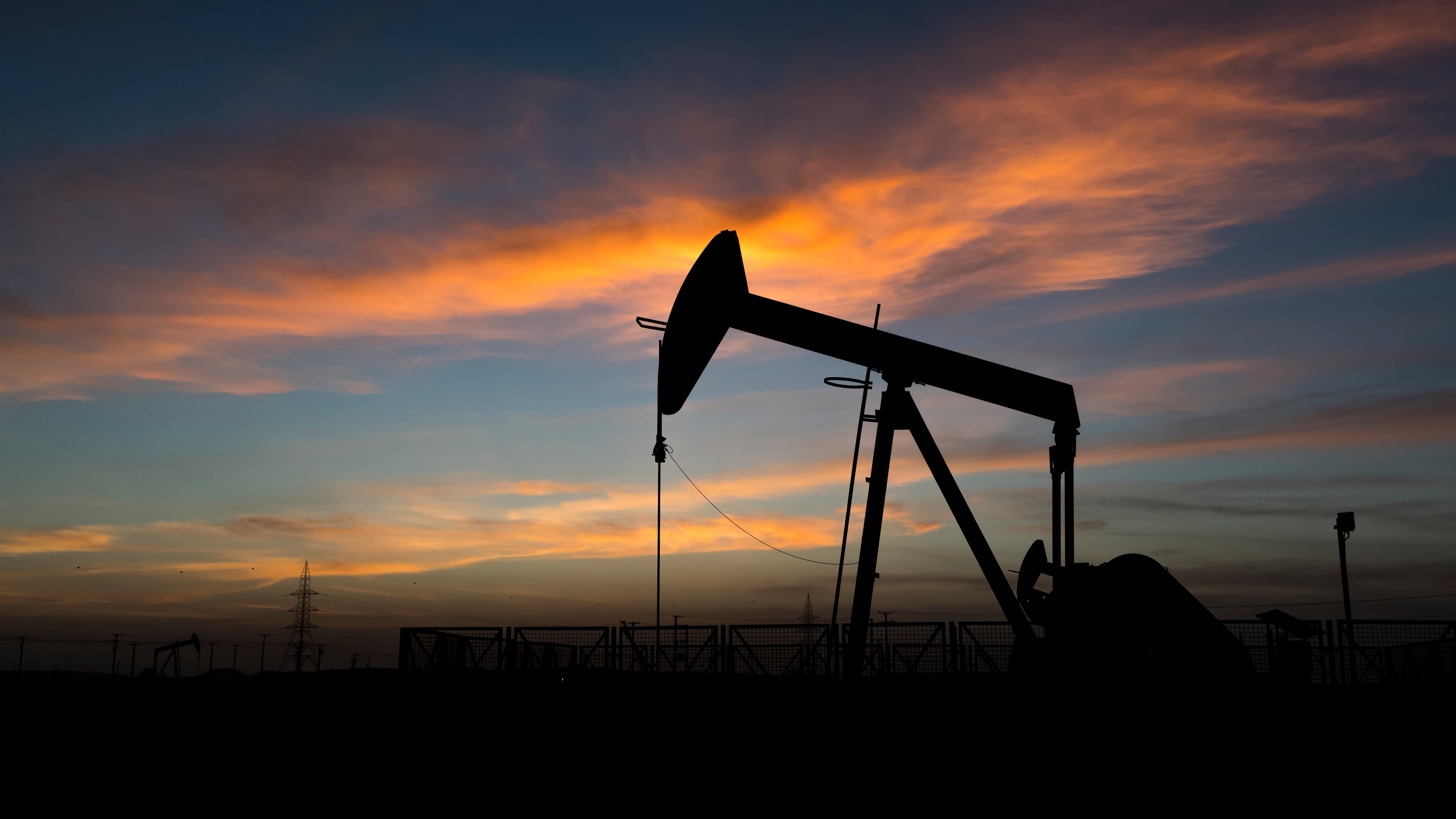 Pumpjack works in an oil field.