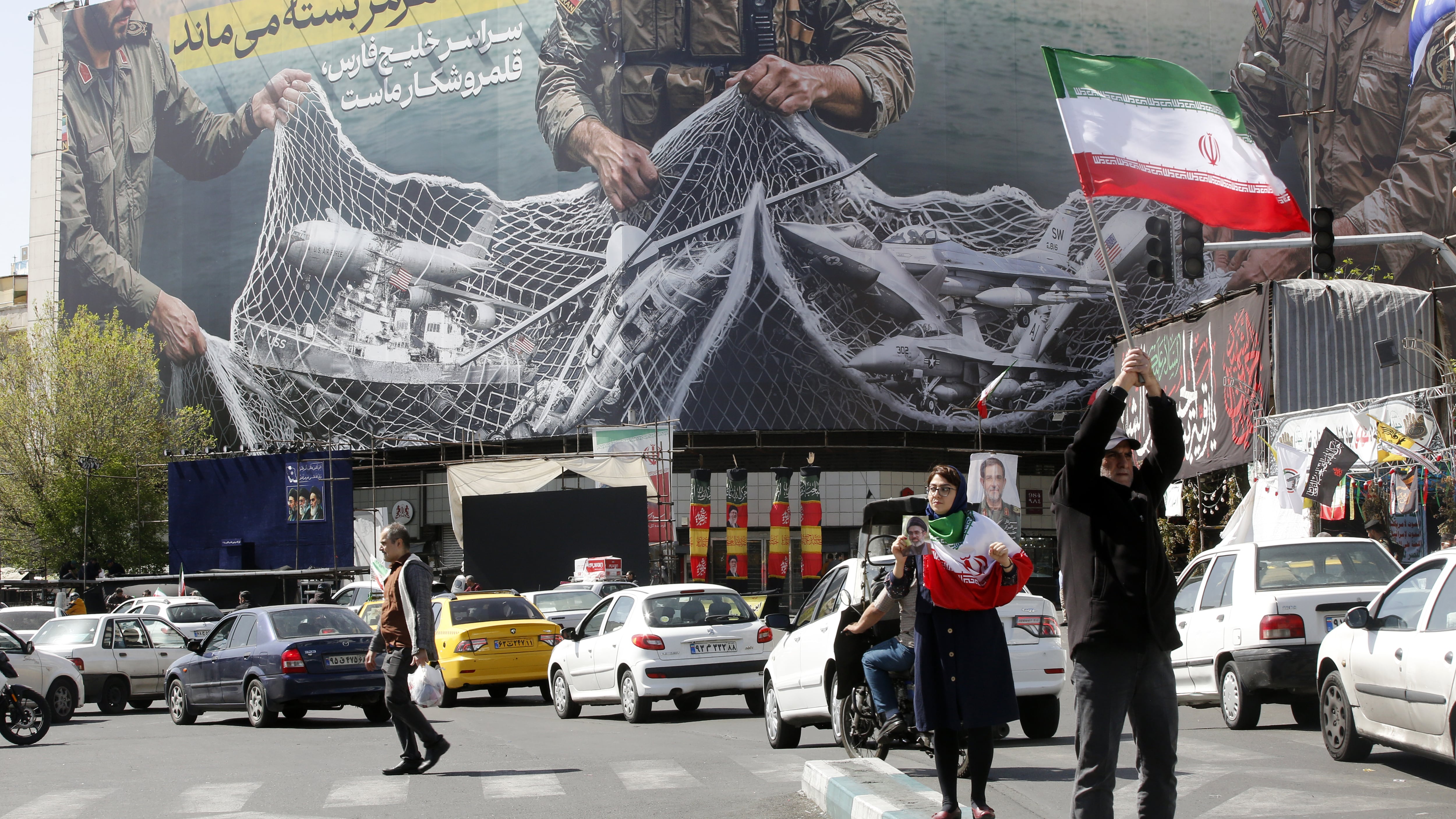 TEHRAN, IRAN - APRIL 05: A general view of the giant banner hung Enghelab Square that reads, 'The Strait of Hormuz will remain closed; the entire Persian Gulf is our hunting ground.' as daily life continues in Tehran, Iran on April 05, 2026. (Photo by Fatemeh Bahrami/Anadolu via Getty Images)