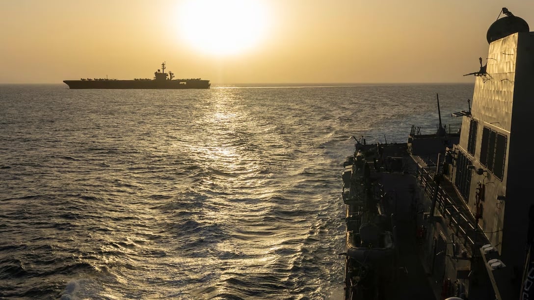 The USS Lincoln against a setting sun